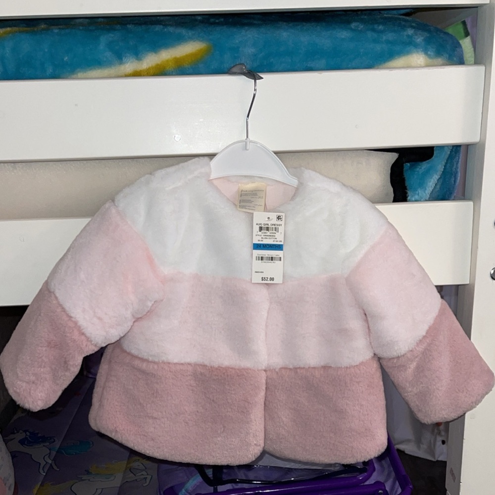 First impression baby girl coat . Very soft material never used :